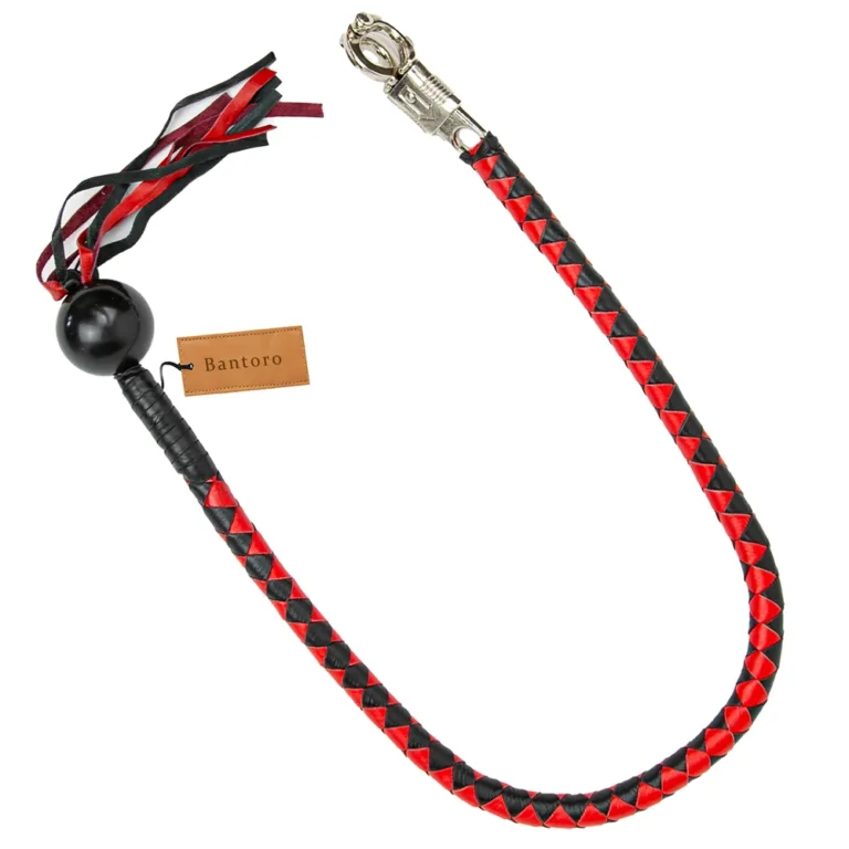 Close-up of red and black hand-braided leather motorcycle handlebar whip (get back whip)