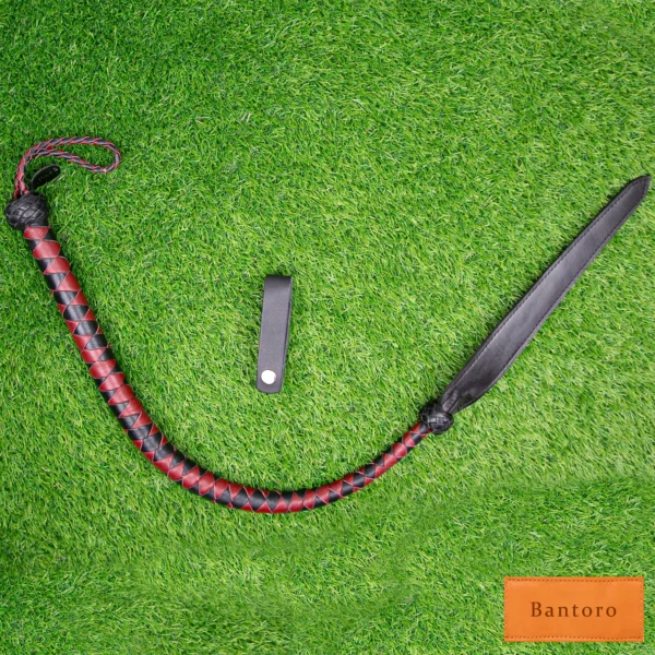 bdsm dragon tail whip black red leather full length flat lay