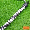 bdsm dragon tail whip black white braided handle close up