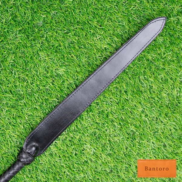 bdsm dragon tail whip black leather slapper tip close up