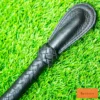bdsm nagaika whip black handle close up braided grip