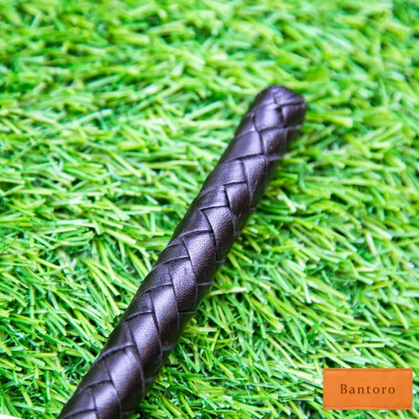 leather bdsm crop braided shaft close-up showing 8 plait design