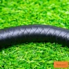 leather flogger premium black braided leather body close up