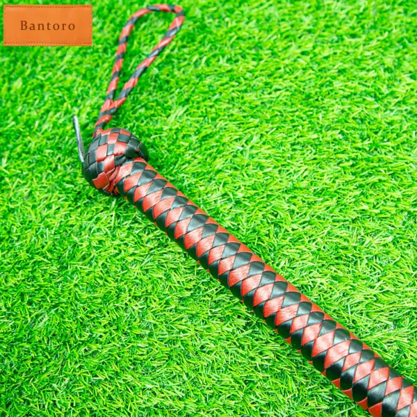 leather flogger premium red black handle close up anti slip grip