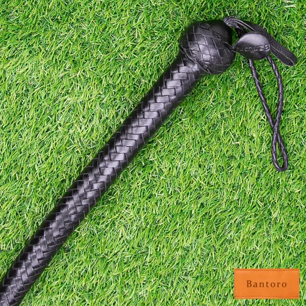 leather single tail flogger handle braided grip close up